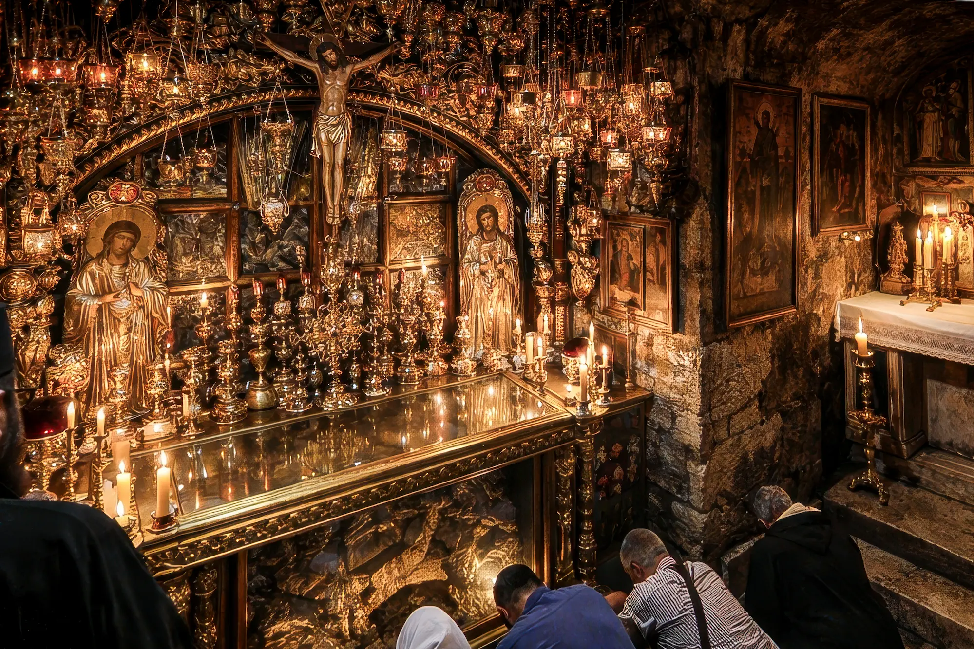 holy sepulchre stone of anointing ritual jerusalem pilgrims touching stone